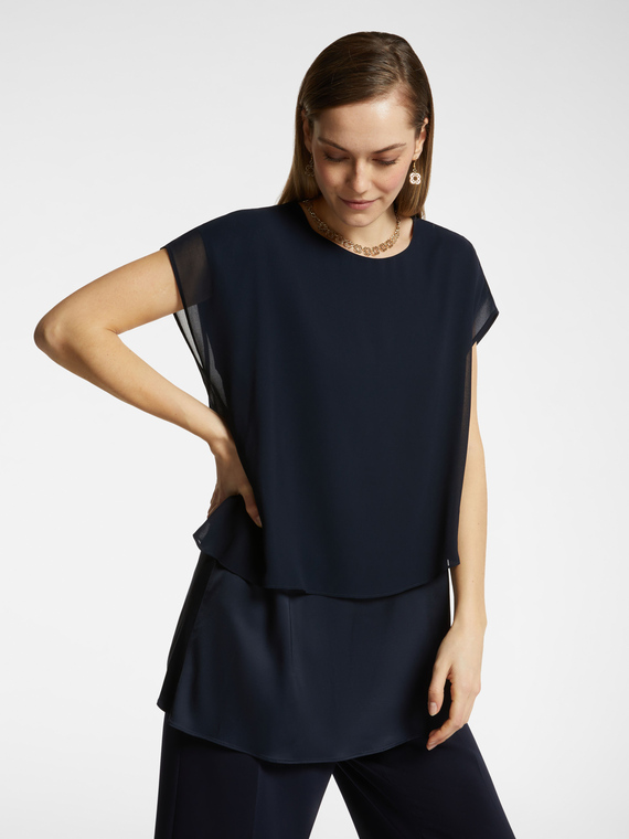 Blusa con sovrapposizione