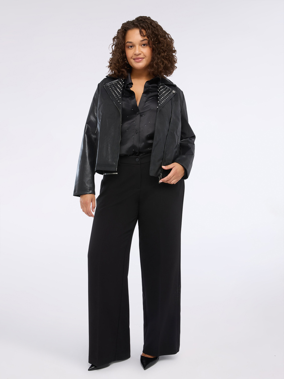 Giacca biker con borchie e zip asimmetrica