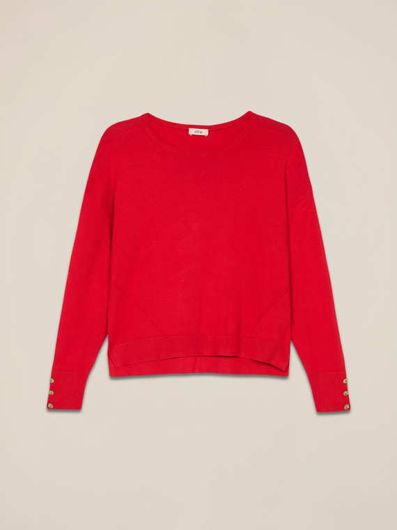 Boxy sweater with buttons at the bottom of the sleeves