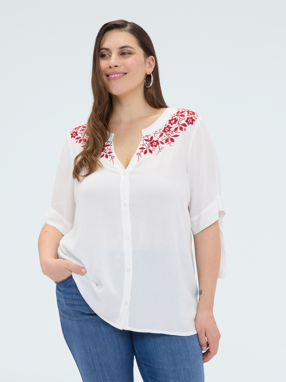 Blusa con ricami floreali
