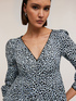 Animal print long sleeved peplum top image number 3