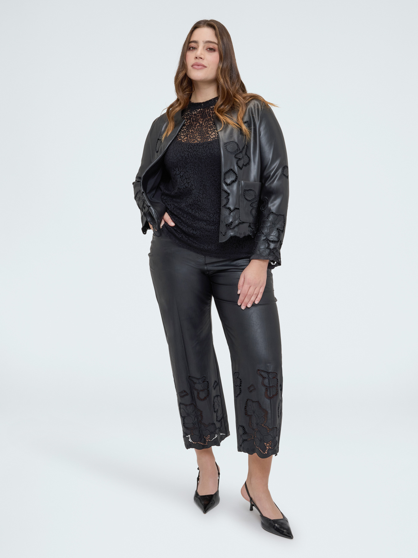 Cropped trousers in coated fabric with floral motifs image number 0