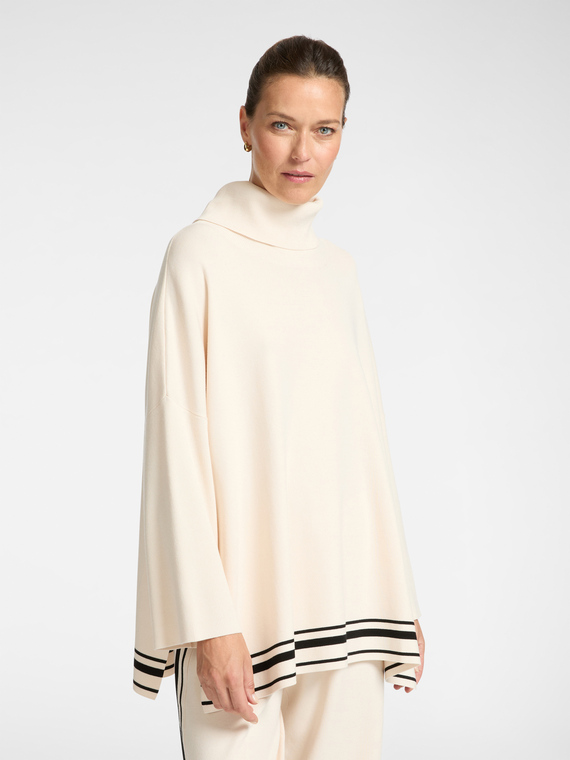 Cape with striped edge