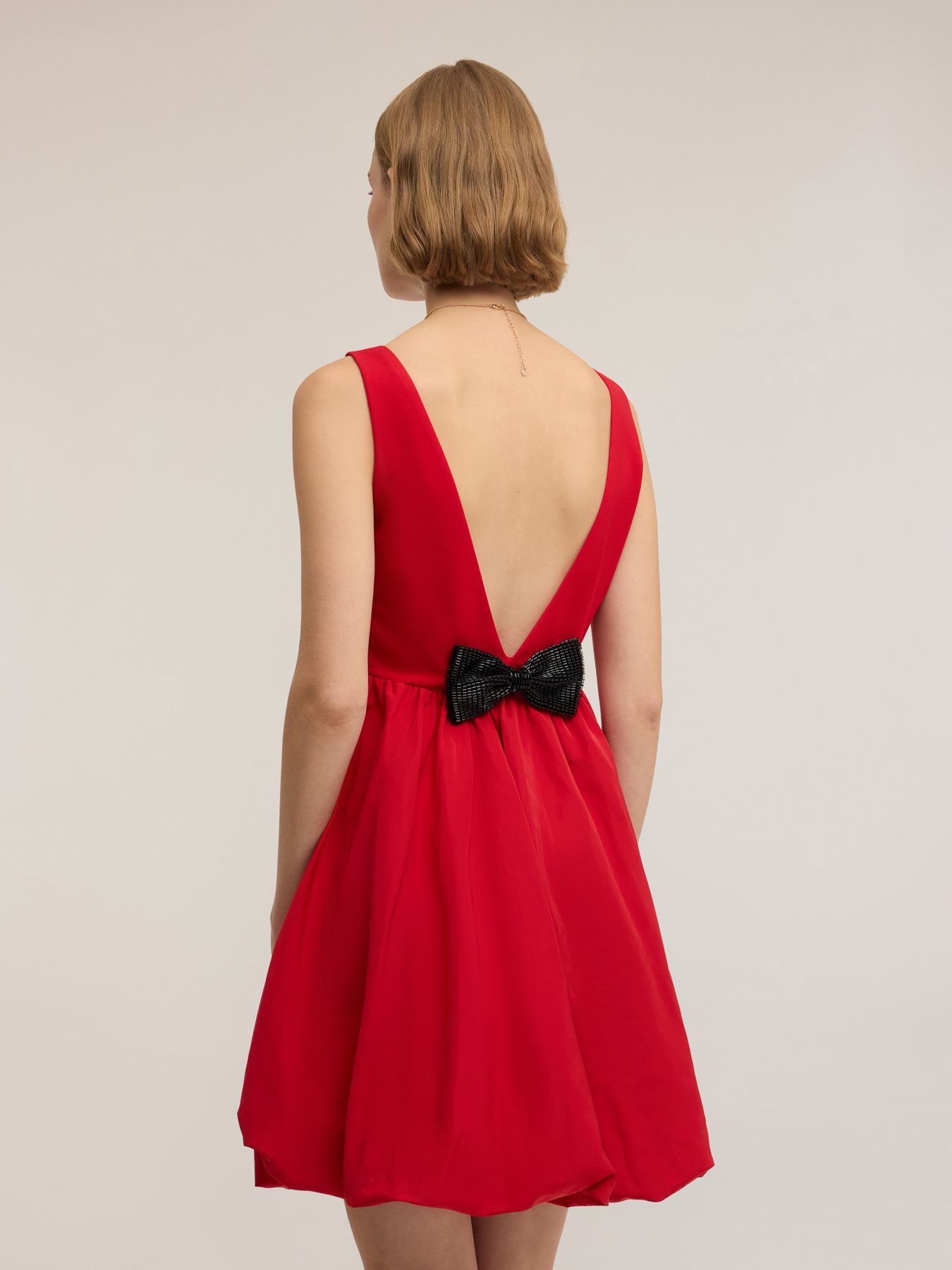 Sleeveless minidress with bow image number 0