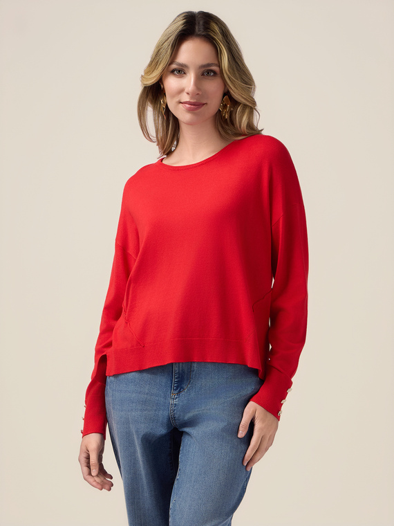 Boxy sweater with buttons at the bottom of the sleeves