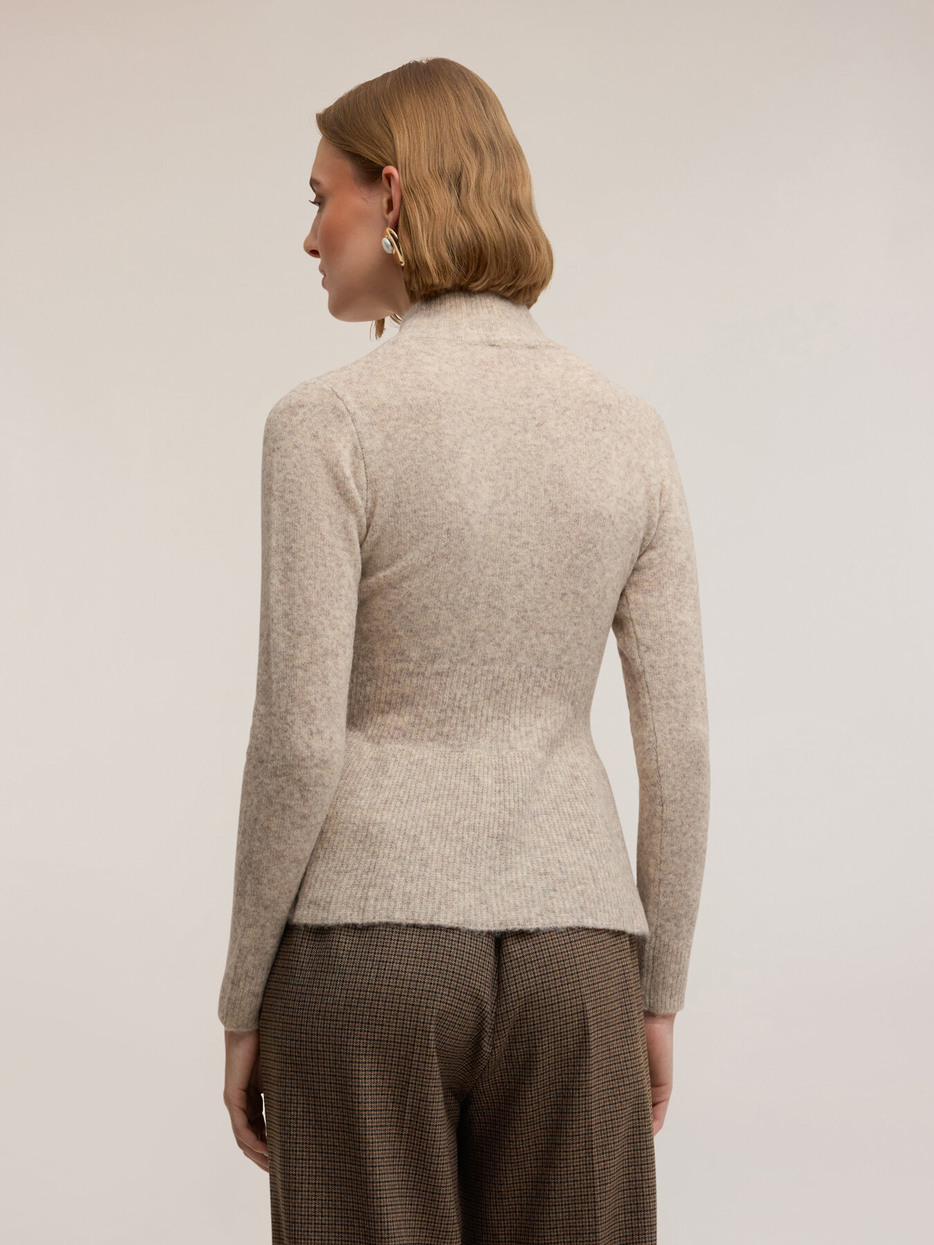 Turtleneck sweater with peplum cut image number 1