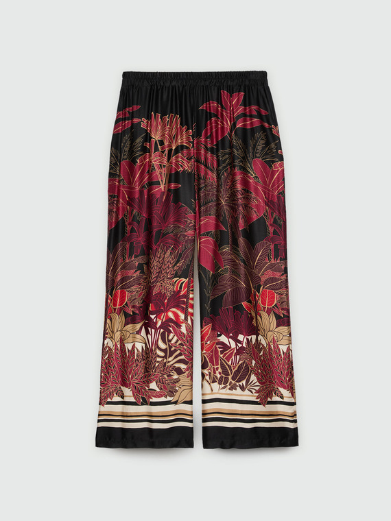 Trousers with tropical print