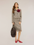 Short boucl&eacute; jacket with fringes and brooch image number 2