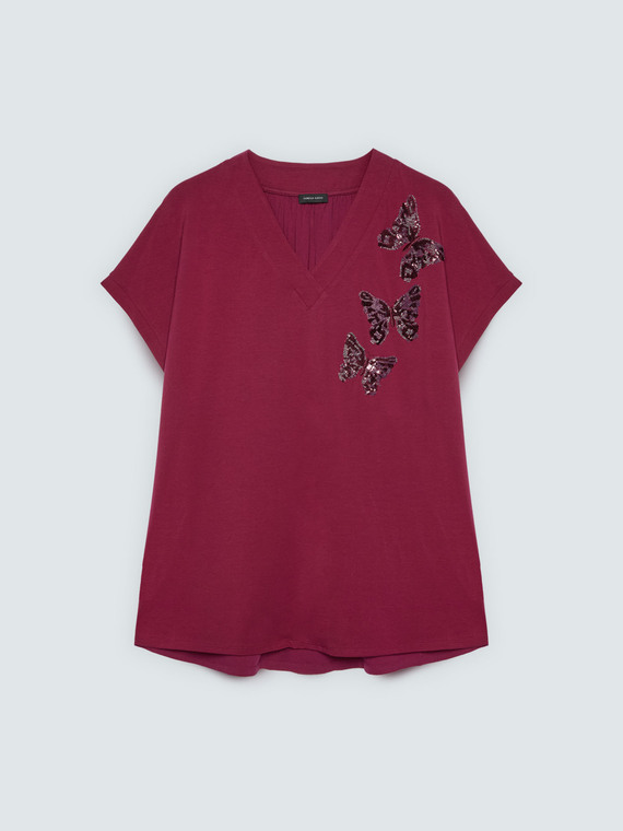 T-shirt bimaterica con farfalle in paillettes