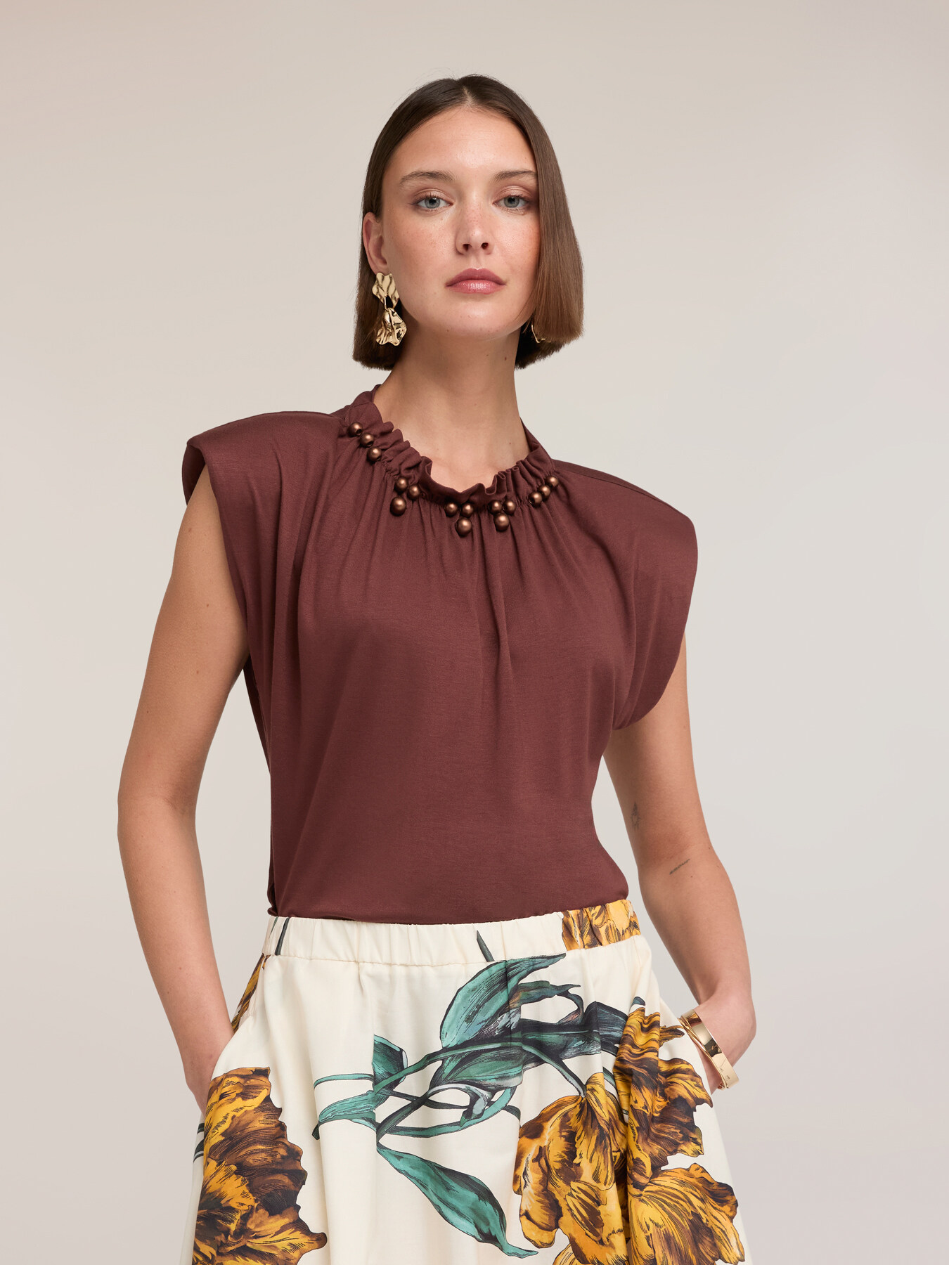 T-shirt with gathering and appliqu&eacute;s on the neckline image number 0