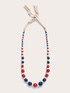 Collana lunga con perline in legno e rafia image number 1