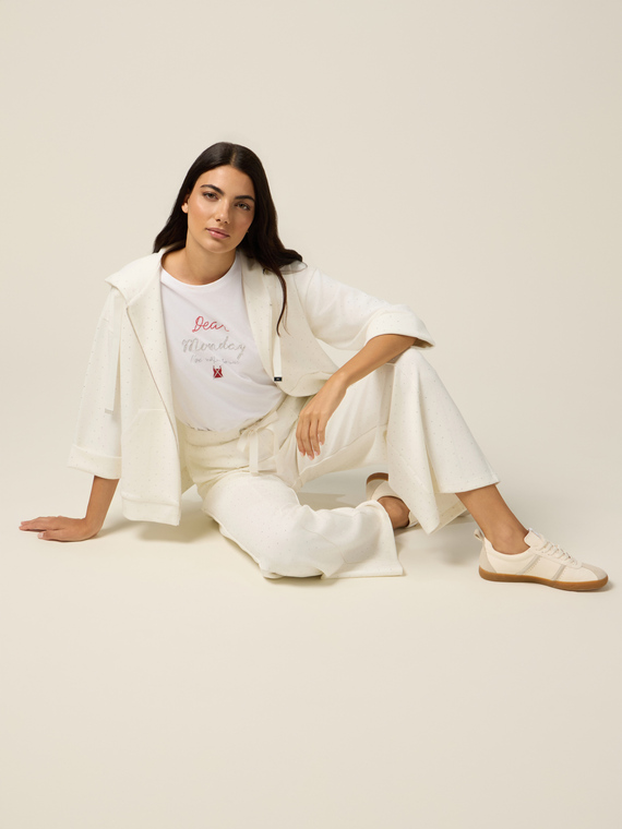 Pantaloni palazzo con micro borchie