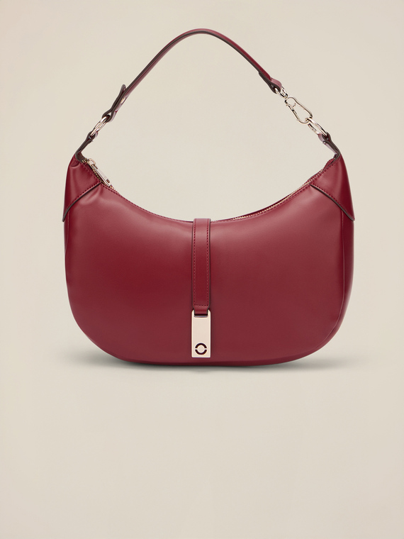 Shoulder bag with zip and metal charm