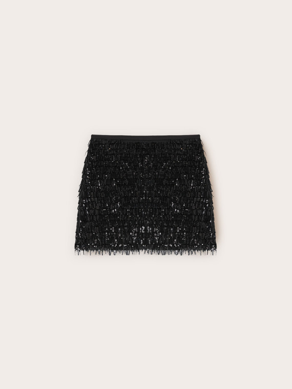 Mini-jupe en tulle à paillettes