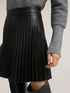 Short pleated skirt in coated fabric image number 3