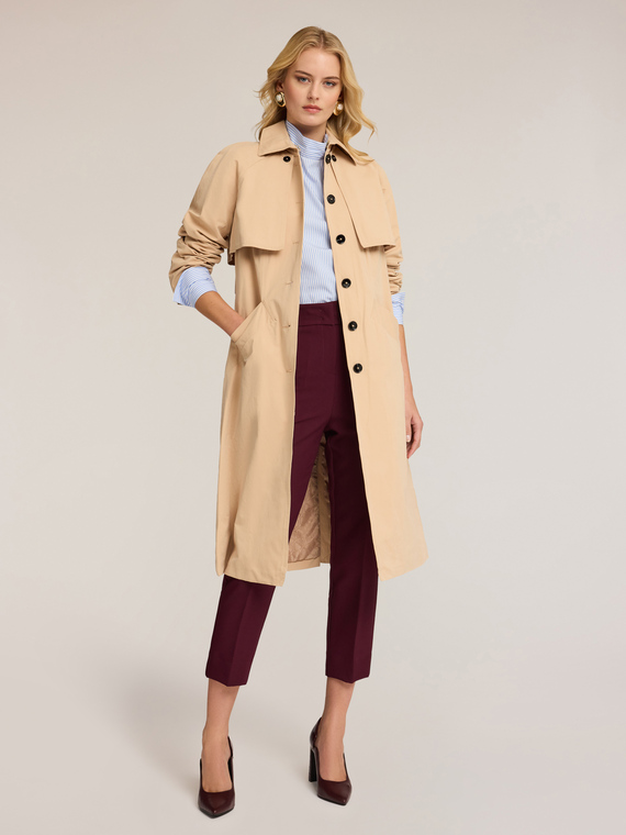Technical fabric trench coat with removable sleeves
