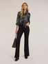 Jeans flare con alamari in metallo image number 0