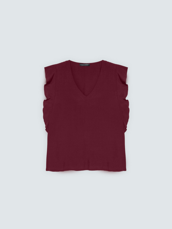 Muslin top with ruffles on the shoulders