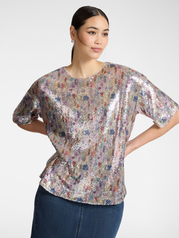 Blusa in tulle con paillettes