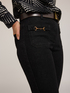 Jeans flare con alamari in metallo image number 3