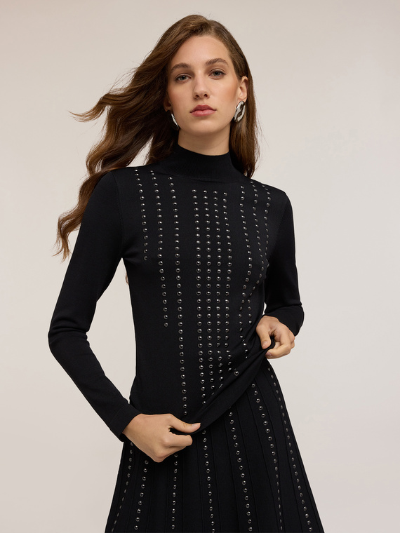 Turtleneck sweater with appliqués