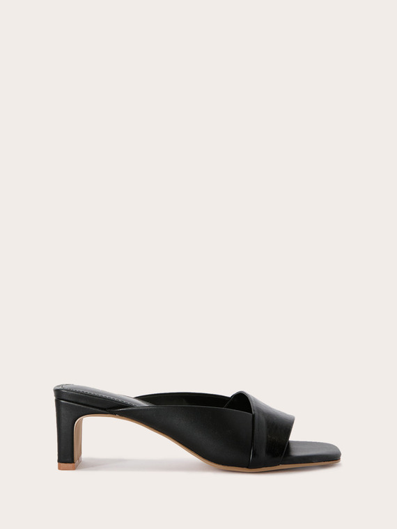 Mules en tissu enduit