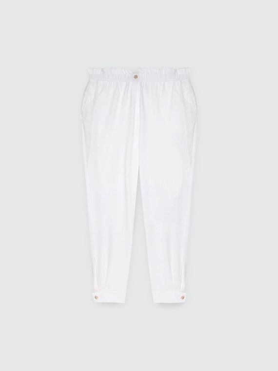 Trousers with embroidered mesh trims