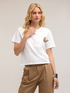 T-shirt with butterfly brooch image number 0
