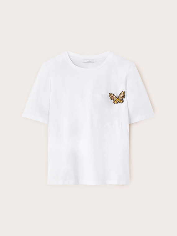 T-shirt with butterfly brooch