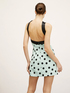 Mini-Kleid mit Punktemuster und Schleife image number 1