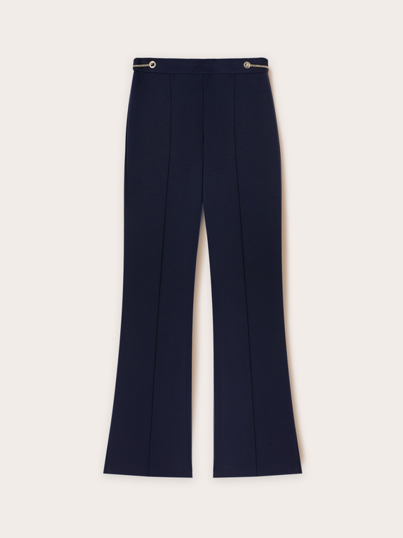 Flared trousers with eyelet pattern