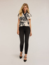 Skinny jeans with buttons image number 3