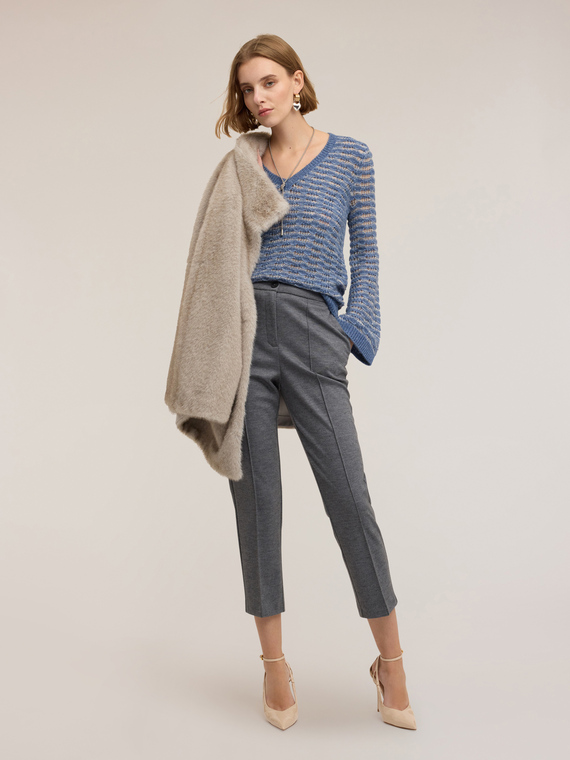 Perforated sweater with flare sleeves