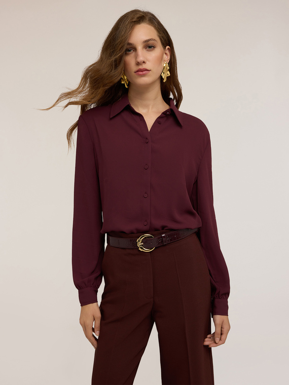 Shirt with covered buttons
