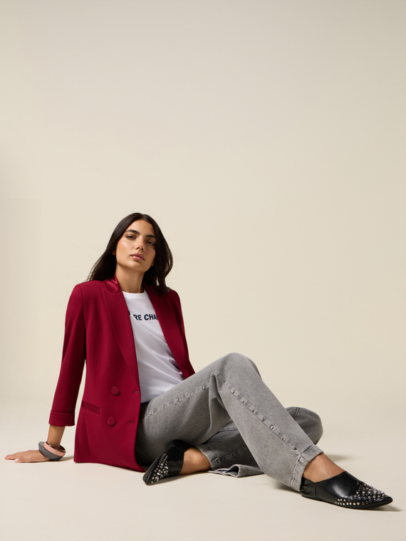 Jeans a palazzo con borchie decorative